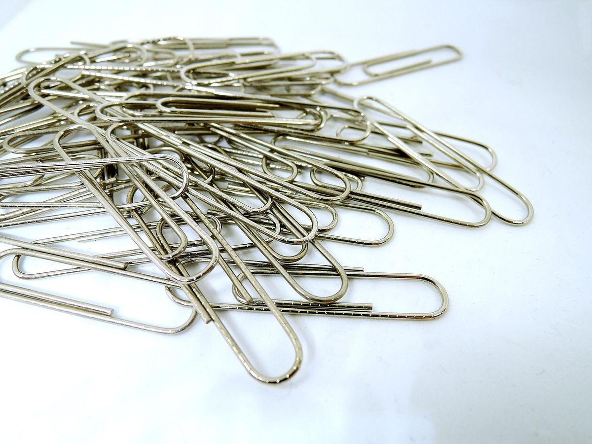 A pile of paperclips, the kind of small tool used to press a recessed reset button