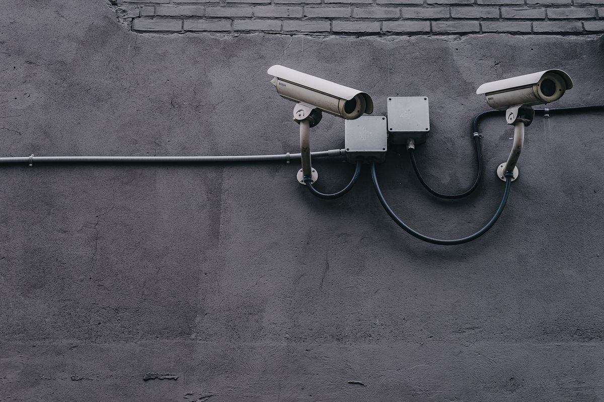 A security camera mounted on a wall