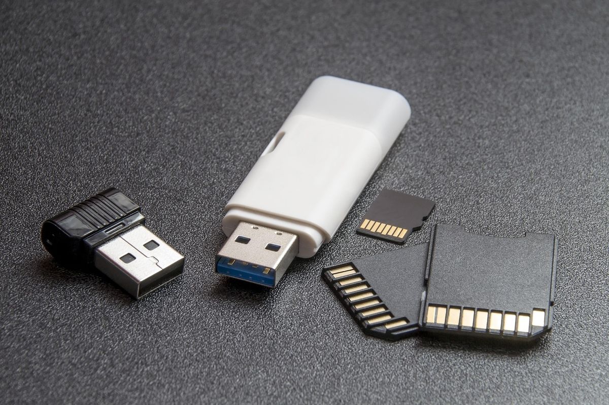 A memory card and USB drive, representing local storage options