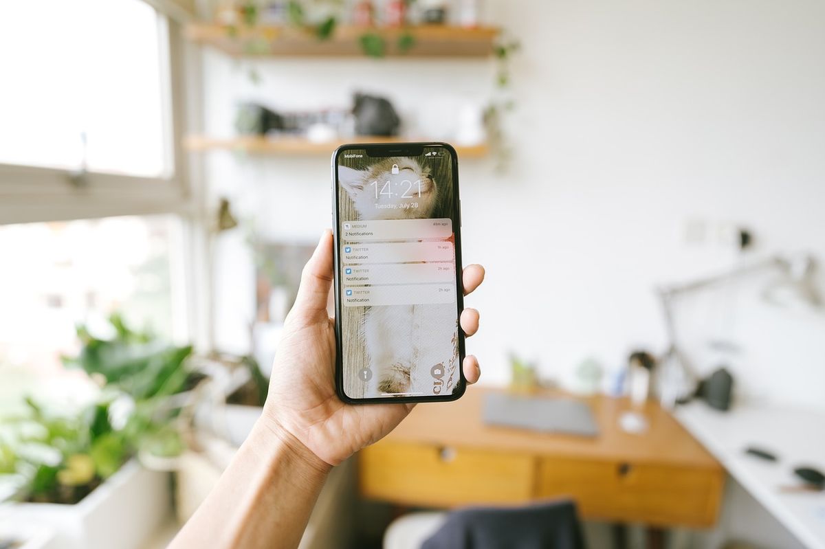 A smartphone displaying notification banners on its lock screen