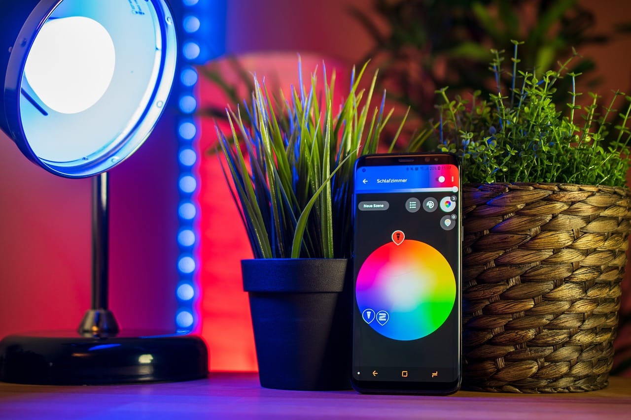 Person using smartphone to control smart home devices with Kasa app