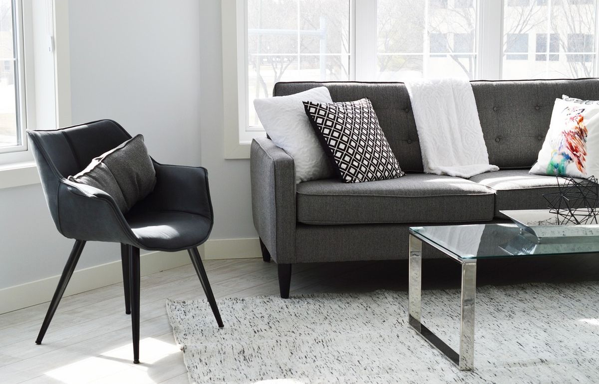 A bright modern living room, the kind of space a home security system monitors