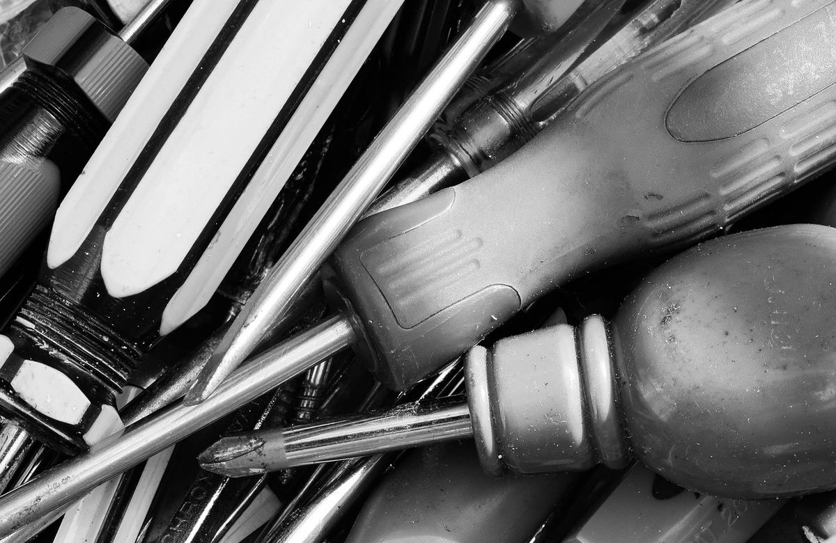 A close-up of assorted screwdrivers, tools used for wall-mount installation