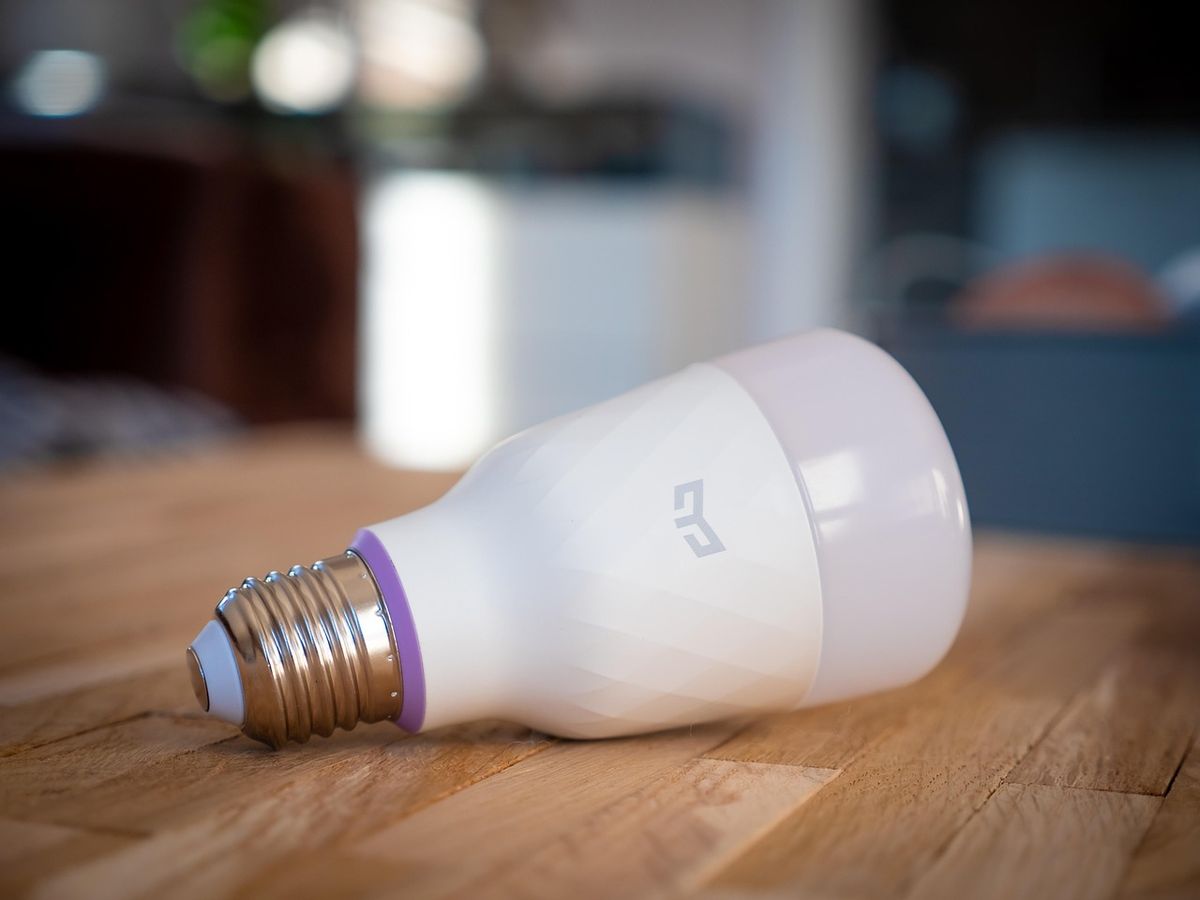 Smart LED light bulb on a wooden table