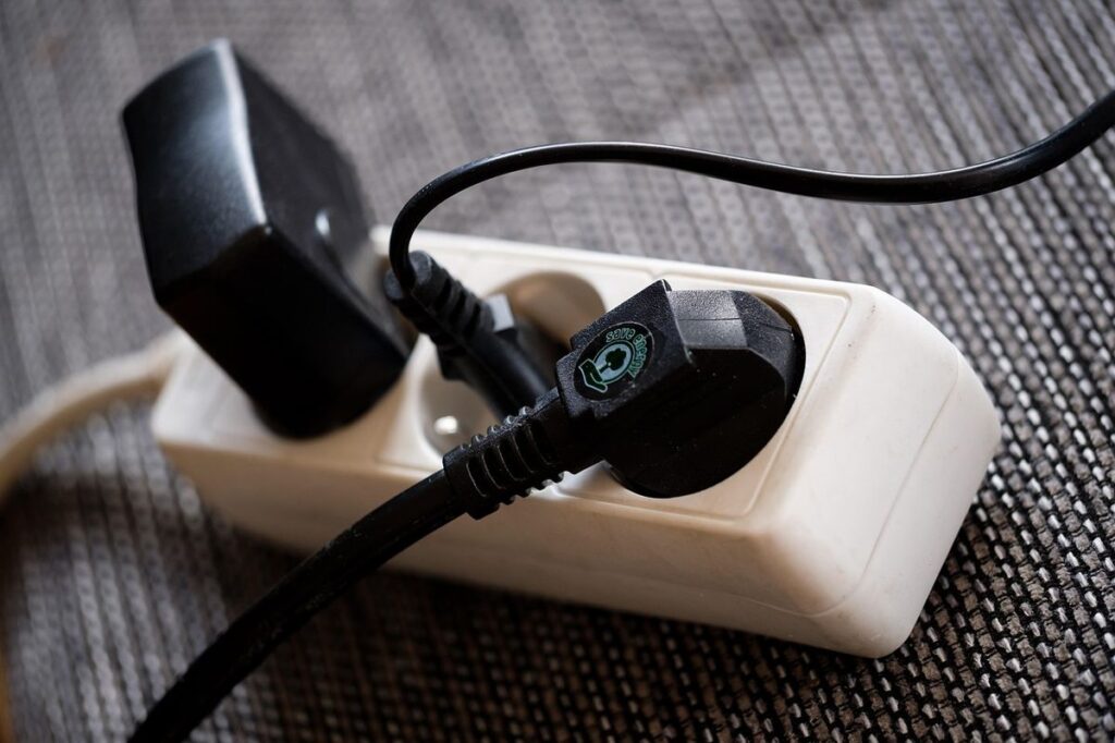 Power strip with multiple devices plugged in